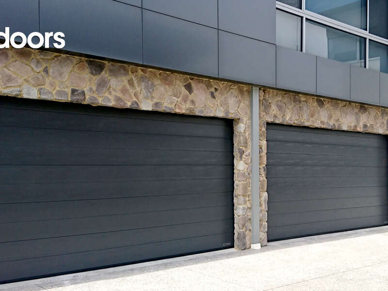 4Ddoors Sectional Garage Door - M-Ribbed Profile in colour 'CH703 Non Metallic', with a Woodgrain Finish